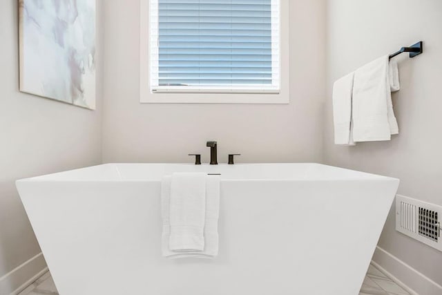 13021 W 174th Pl, Overland Park, KS 66221 - bathroom with baseboards and a soaking tub