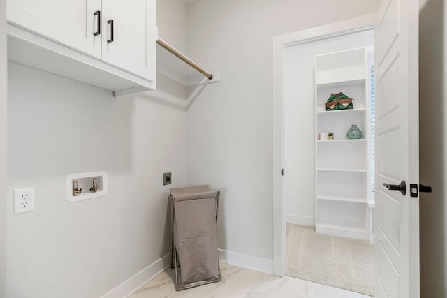 13021 W 174th Pl, Overland Park, KS 66221 - laundry room with cabinet space, electric dryer hookup, washer hookup, light marble finish flooring, and baseboards