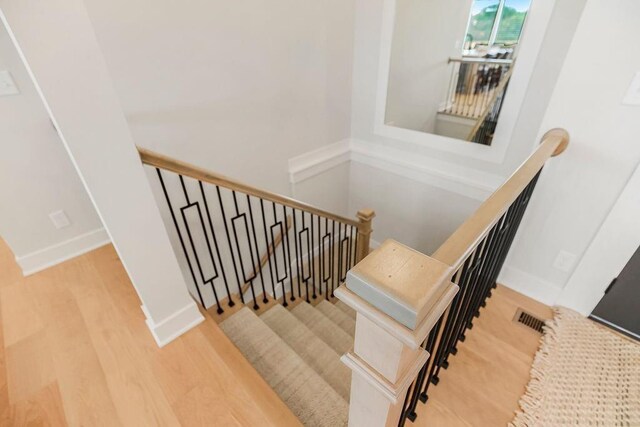 13021 W 174th Pl, Overland Park, KS 66221 - staircase with wood finished floors and baseboards