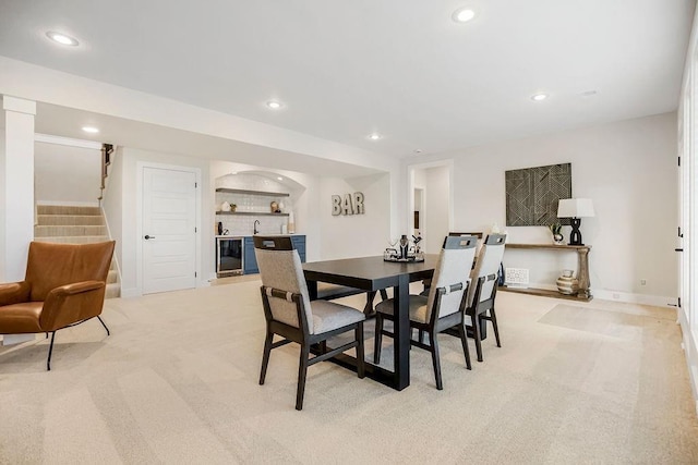 13021 W 174th Pl, Overland Park, KS 66221 - carpeted dining room with bar, stairway, recessed lighting, and beverage cooler