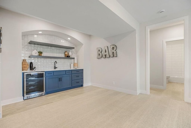 13021 W 174th Pl, Overland Park, KS 66221 - indoor wet bar featuring wine cooler, decorative backsplash, light carpet, baseboards, and recessed lighting