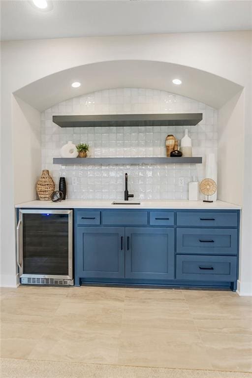 13021 W 174th Pl, Overland Park, KS 66221 - indoor wet bar featuring beverage cooler, tasteful backsplash, baseboards, and recessed lighting