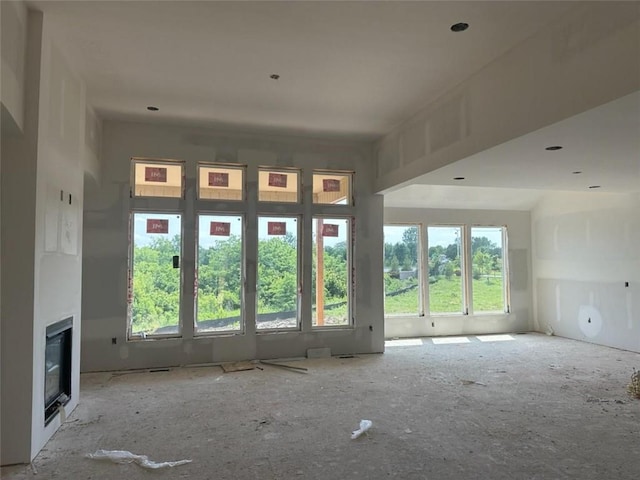 13021 W 174th Pl, Overland Park, KS 66221 - unfurnished living room with a glass covered fireplace