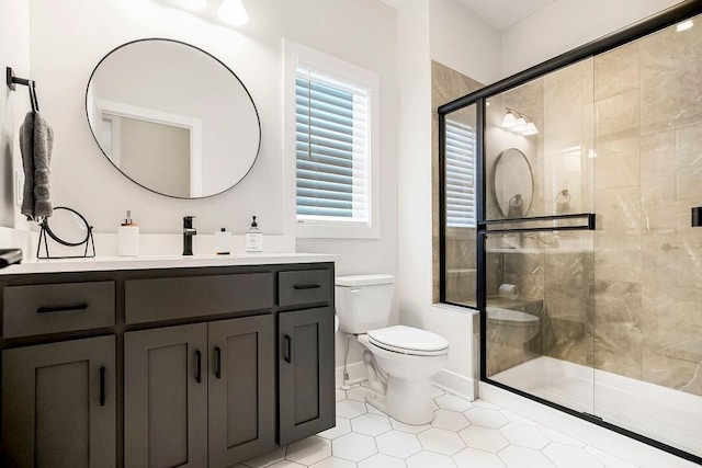 13021 W 174th Pl, Overland Park, KS 66221 - full bath with toilet, vanity, a shower stall, and baseboards