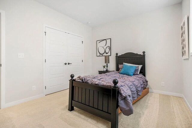 13021 W 174th Pl, Overland Park, KS 66221 - bedroom featuring carpet flooring, baseboards, and a closet