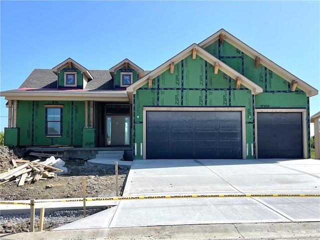 13021 W 174th Pl, Overland Park, KS 66221 - property under construction featuring a garage, driveway, and a porch