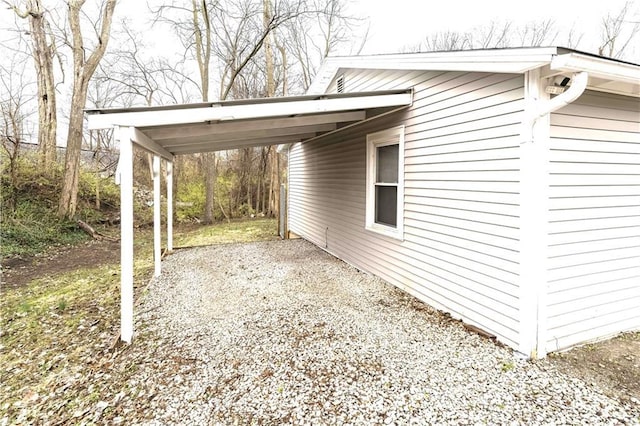 607 SW 8th St, Blue Springs, MO 64015 - exterior space featuring a carport and gravel driveway