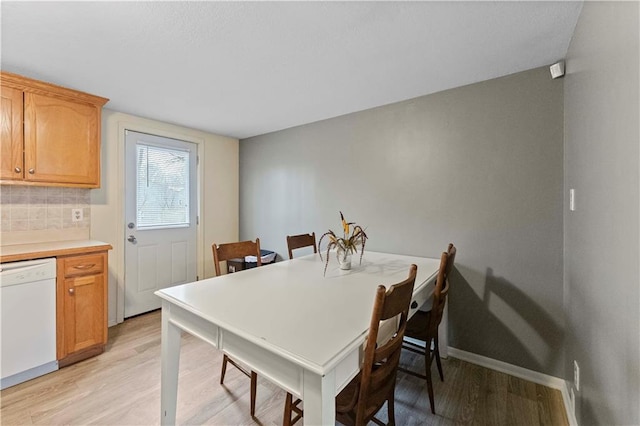607 SW 8th St, Blue Springs, MO 64015 - dining space with light wood-type flooring and baseboards