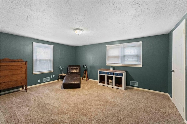 607 SW 8th St, Blue Springs, MO 64015 - sitting room featuring visible vents, baseboards, and carpet