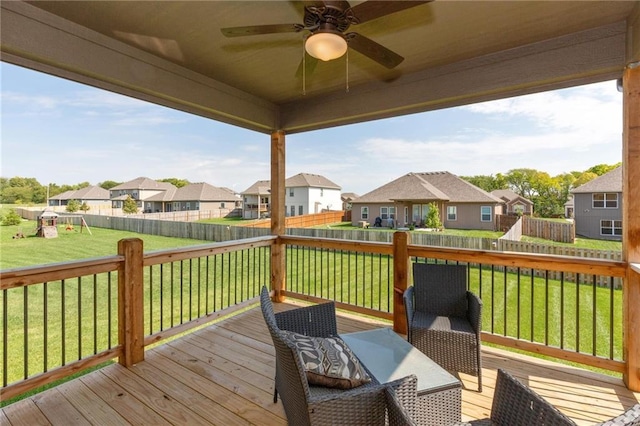 16487 W 166th Pl, Olathe, KS 66062 - wooden deck featuring a residential view, a ceiling fan, a fenced backyard, and a playground