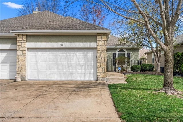 ranch-style home with stone siding, concrete driveway, roof with shingles, an attached garage, and a front lawn