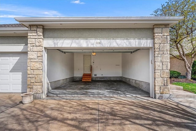 garage featuring driveway