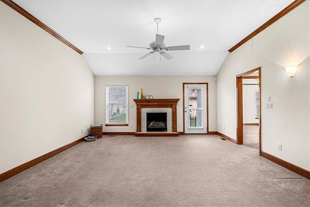 unfurnished living room with baseboards, lofted ceiling, and carpet