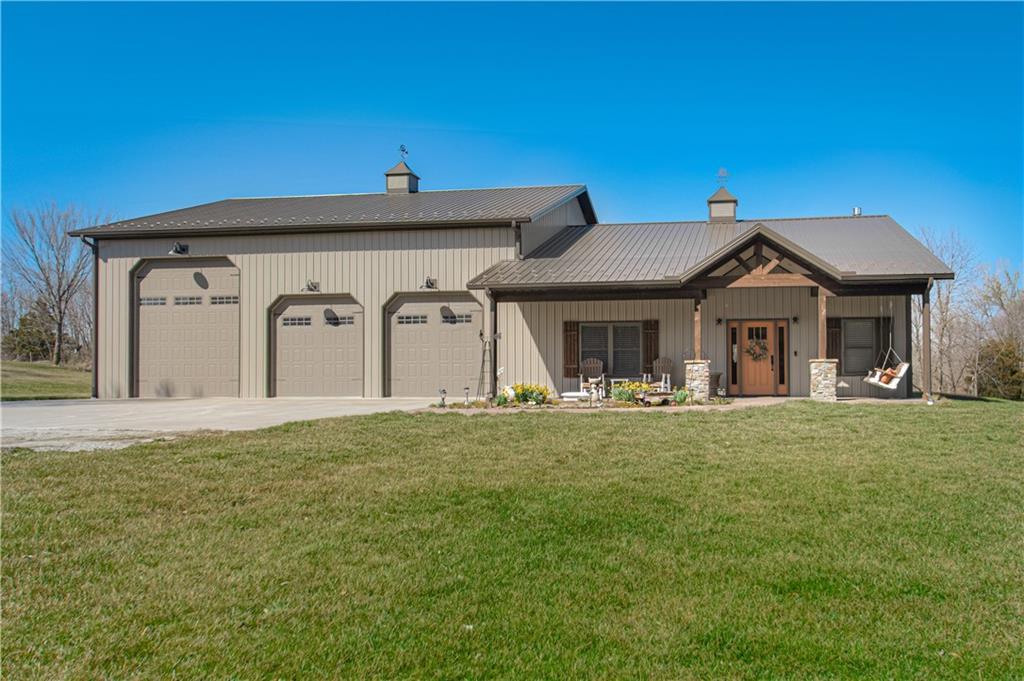 4138 SW 206th St, Plattsburg, MO 64477 - view of front of home with a front yard, driveway, and a garage