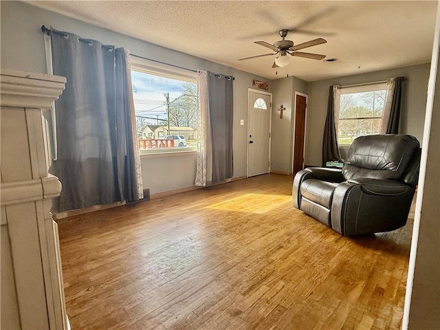 611 E Elm St, Hardin, MO 64035 - sitting room featuring light wood-style flooring and a ceiling fan