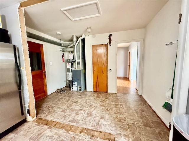 611 E Elm St, Hardin, MO 64035 - kitchen with freestanding refrigerator and stone finish flooring