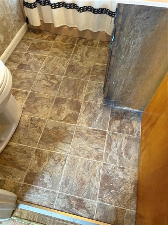 611 E Elm St, Hardin, MO 64035 - bathroom featuring toilet