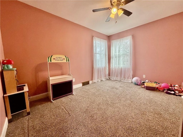 611 E Elm St, Hardin, MO 64035 - recreation room featuring carpet floors and a ceiling fan
