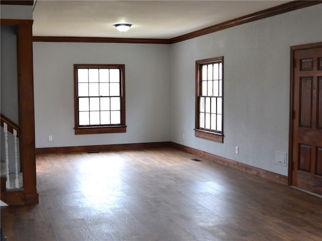 660 Elmdale, Chillicothe, MO 64601 - spare room with ornamental molding, baseboards, and wood finished floors