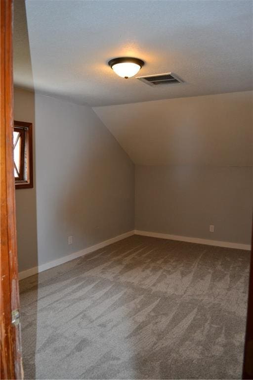 660 Elmdale, Chillicothe, MO 64601 - bonus room featuring carpet flooring, baseboards, visible vents, and vaulted ceiling