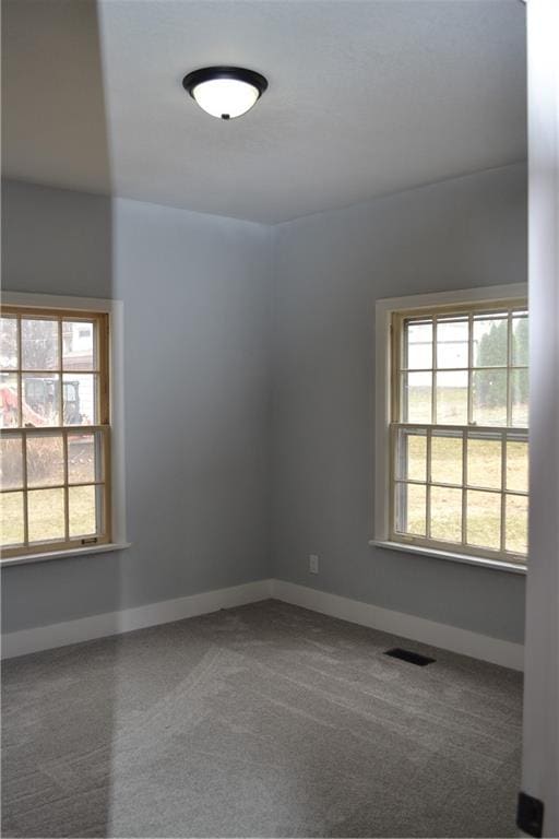 660 Elmdale, Chillicothe, MO 64601 - spare room featuring visible vents, baseboards, and carpet