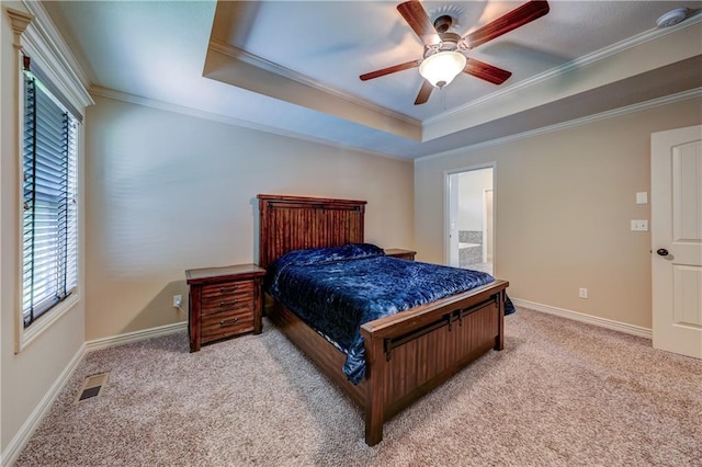 bedroom featuring carpet floors, multiple windows, crown molding, and a raised ceiling