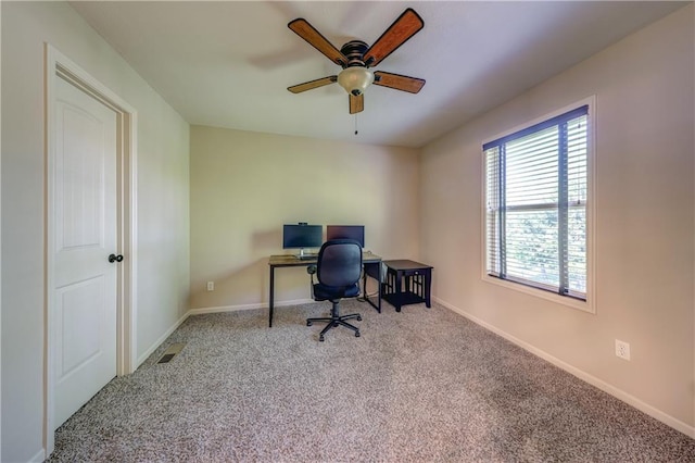 office area with carpet floors, ceiling fan, and baseboards