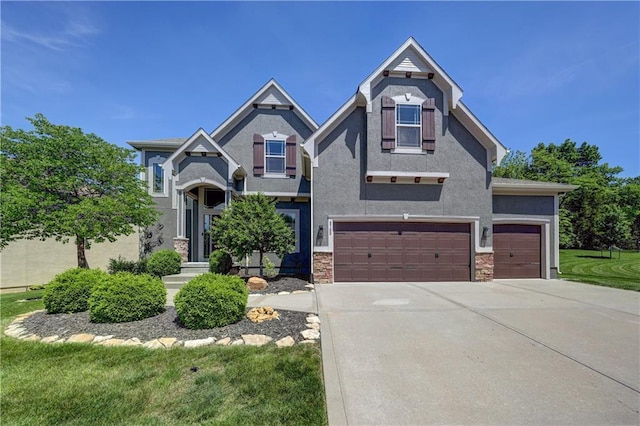 view of front of property featuring driveway, stucco siding, an attached garage, and a front lawn