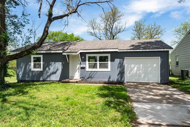 1758 Main St, Osawatomie, KS 66064 - ranch-style home with an attached garage, a front lawn, central AC, and concrete driveway