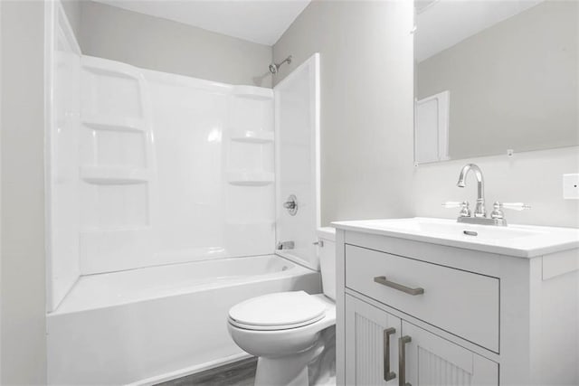 1758 Main St, Osawatomie, KS 66064 - full bath with vanity, toilet, wood finished floors, and tub / shower combination