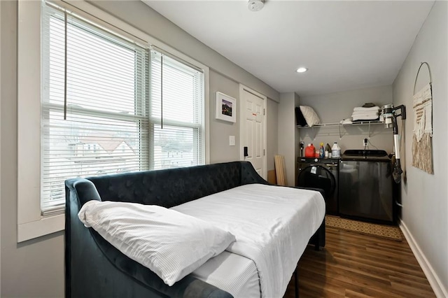 bedroom with dark wood-style floors, recessed lighting, washing machine and clothes dryer, and baseboards
