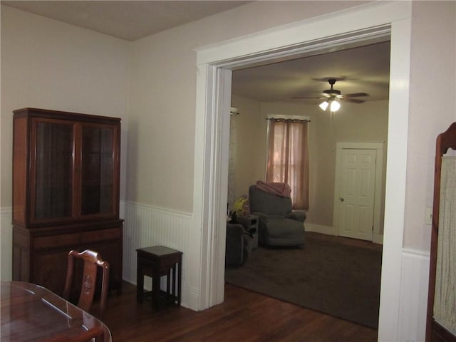 1202 N 8th St, Saint Joseph, MO 64501 - dining room with wainscoting, wood finished floors, and a ceiling fan