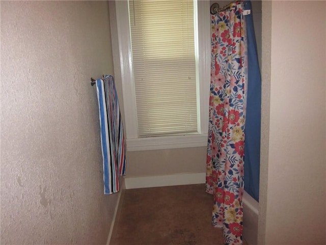 1202 N 8th St, Saint Joseph, MO 64501 - bathroom with baseboards and shower / bathtub combination with curtain