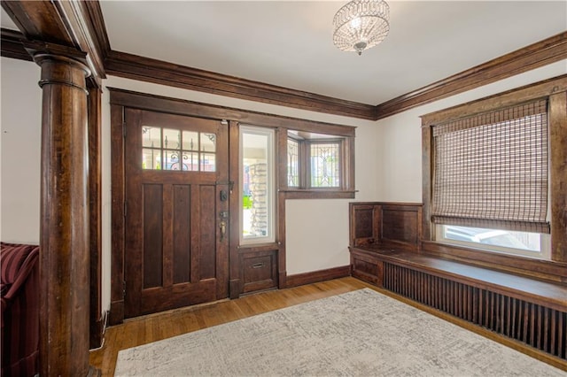 3008 E Linwood Blvd, Kansas City, MO 64128 - foyer with baseboards, wood finished floors, a notable chandelier, and ornamental molding