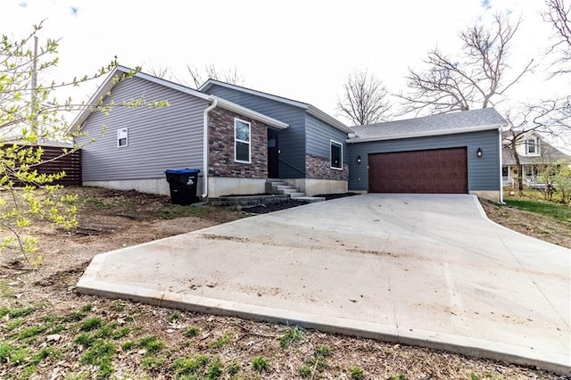view of front facade featuring an attached garage and concrete driveway