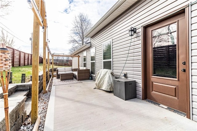 view of patio with an outdoor hangout area, a grill, and fence