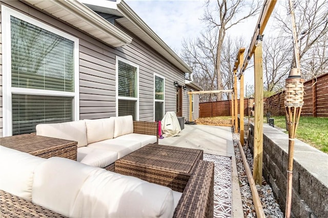 view of patio / terrace featuring outdoor lounge area and fence