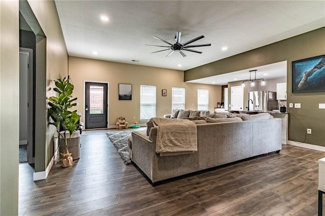 living area featuring a ceiling fan, dark wood-style flooring, baseboards, and recessed lighting