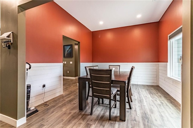 dining room with a wainscoted wall, recessed lighting, and wood finished floors