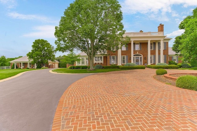 17960 S Bond St, Bucyrus, KS 66013 - greek revival house featuring curved driveway and a chimney