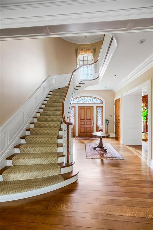17960 S Bond St, Bucyrus, KS 66013 - foyer entrance with stairs, light wood-style flooring, and crown molding