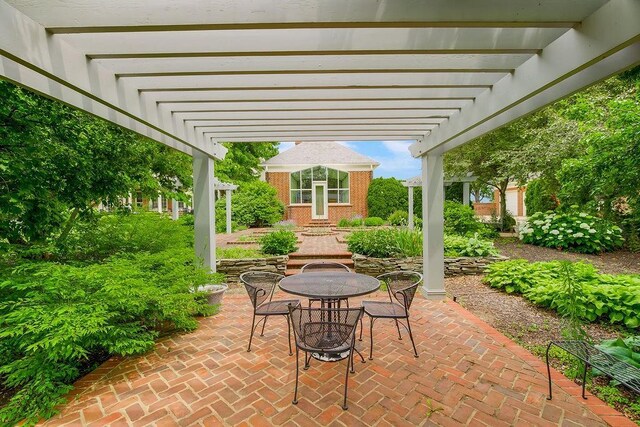 17960 S Bond St, Bucyrus, KS 66013 - view of patio featuring a pergola and outdoor dining space