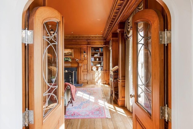 17960 S Bond St, Bucyrus, KS 66013 - entrance foyer featuring crown molding, arched walkways, and light wood-type flooring