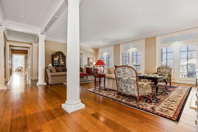 17960 S Bond St, Bucyrus, KS 66013 - living area with decorative columns, crown molding, and wood-type flooring