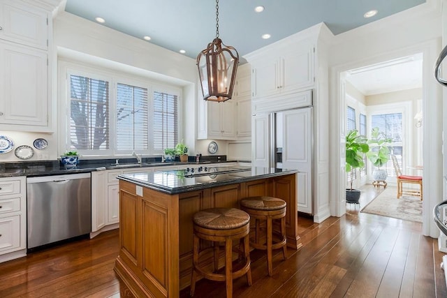 17960 S Bond St, Bucyrus, KS 66013 - kitchen featuring stainless steel dishwasher, dark countertops, a center island, white cabinets, and recessed lighting