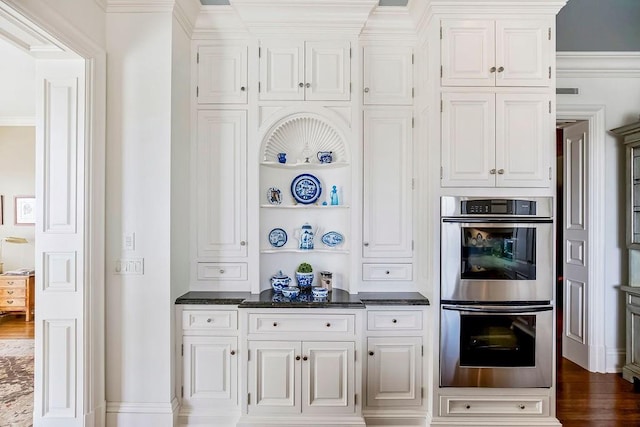 17960 S Bond St, Bucyrus, KS 66013 - kitchen featuring stainless steel double oven, dark countertops, white cabinetry, and ornamental molding