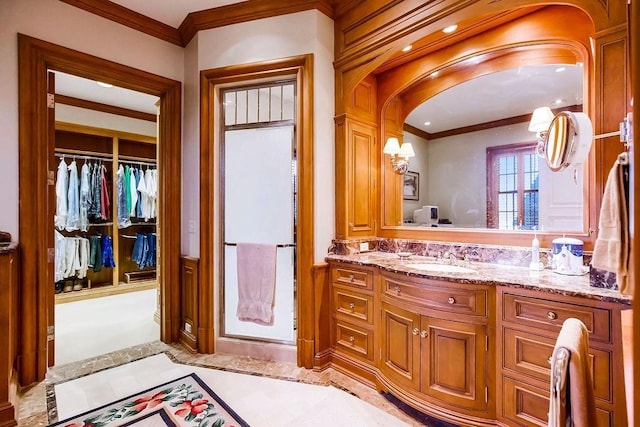 17960 S Bond St, Bucyrus, KS 66013 - bathroom with crown molding, vanity, a walk in closet, and wainscoting