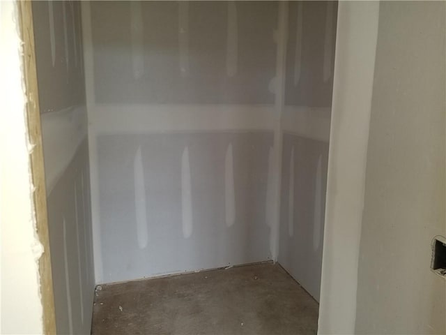 4275 Lake Shore Ct, Basehor, KS 66007 - empty room with unfinished concrete flooring