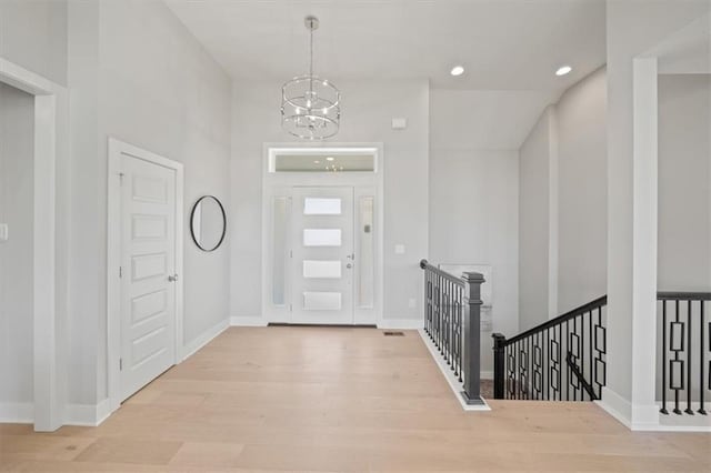 4275 Lake Shore Ct, Basehor, KS 66007 - foyer entrance featuring a chandelier, wood finished floors, baseboards, and recessed lighting
