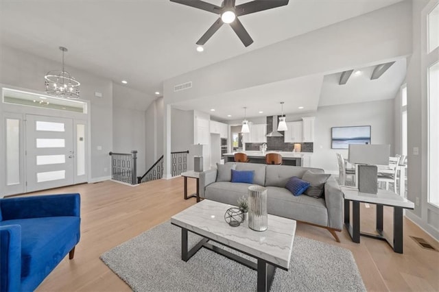 4275 Lake Shore Ct, Basehor, KS 66007 - living room with light wood-style floors, recessed lighting, a chandelier, plenty of natural light, and baseboards